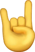 Emoji of a hand with the index and pink fingers extended, also known as the universal 'rock on' symbol.